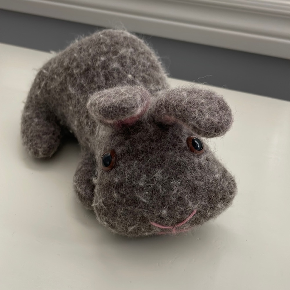 Hand knit and felted bunny with button eyes.